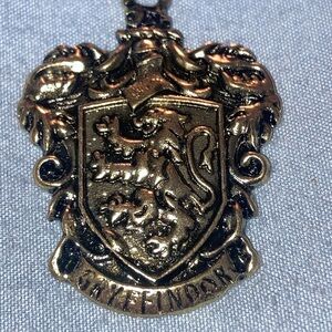 Hufflepuff? Gryffindor Crest Pendant - Gold Tone